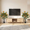 40-inch artificial camellia tree with 37 vibrant flowers and decorative river stones, perfect for living room decor.