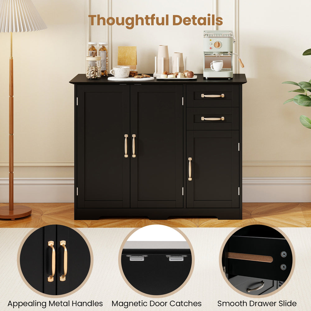 Close-up of the elegant gold-tone metal handles on the black modern kitchen sideboard buffet cabinet for a stylish.