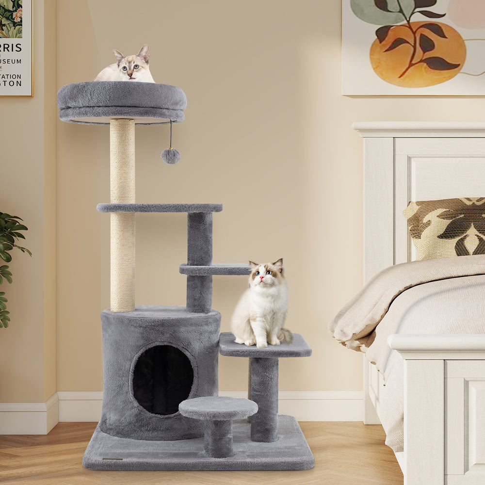 Multi-level gray cat tower with condo, scratching posts, and dangling jingle ball for playful and cozy lounging.