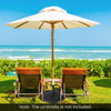 Round 40LBS outdoor umbrella base with a sturdy metal pole, designed for securing patio umbrellas in gardens or cafes.
