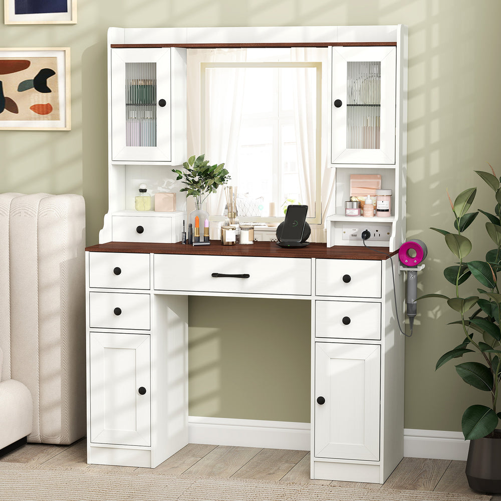 Makeup dressing table with lighted mirror, storage drawers, and power outlets, perfect for bedrooms or studios.