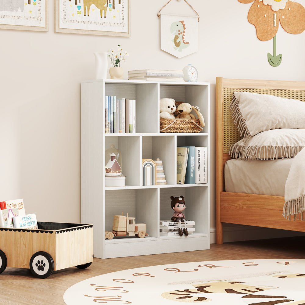 7-section freestanding bookshelf in white for kids, featuring open cubes for storage and a spacious top for display.