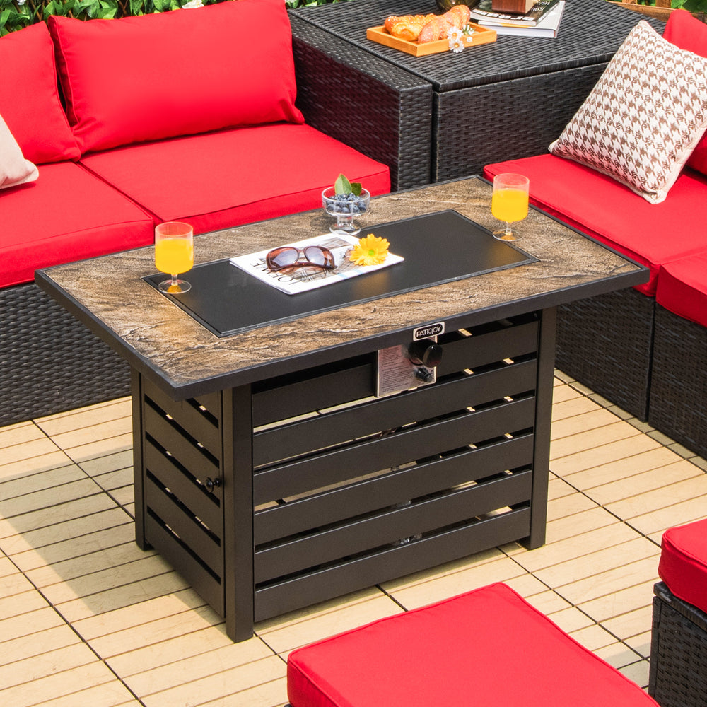 42-inch propane fire pit table with ore powder surface, featuring a solid steel structure and lava rocks for outdoor.