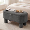 Gray corduroy storage ottoman bench featuring plush upholstery and a convenient lifting strap, perfect for stylish home.