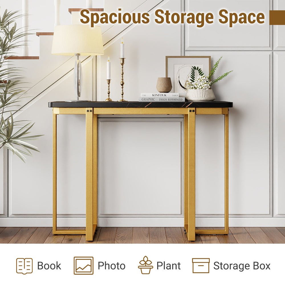 Modern faux marble entryway table with geometric golden metal frame, offering ample storage for books and plants.