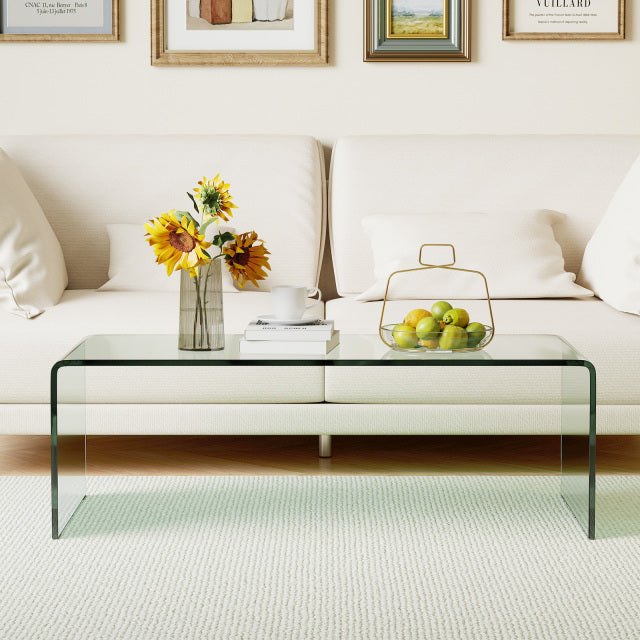 Clear tempered glass coffee table with rounded edges, 42 x 19.7 inches, perfect for living room decor.