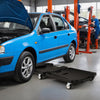Foldable mechanic creeper in black with padded headrest and tool trays, designed for easy mobility under vehicles.