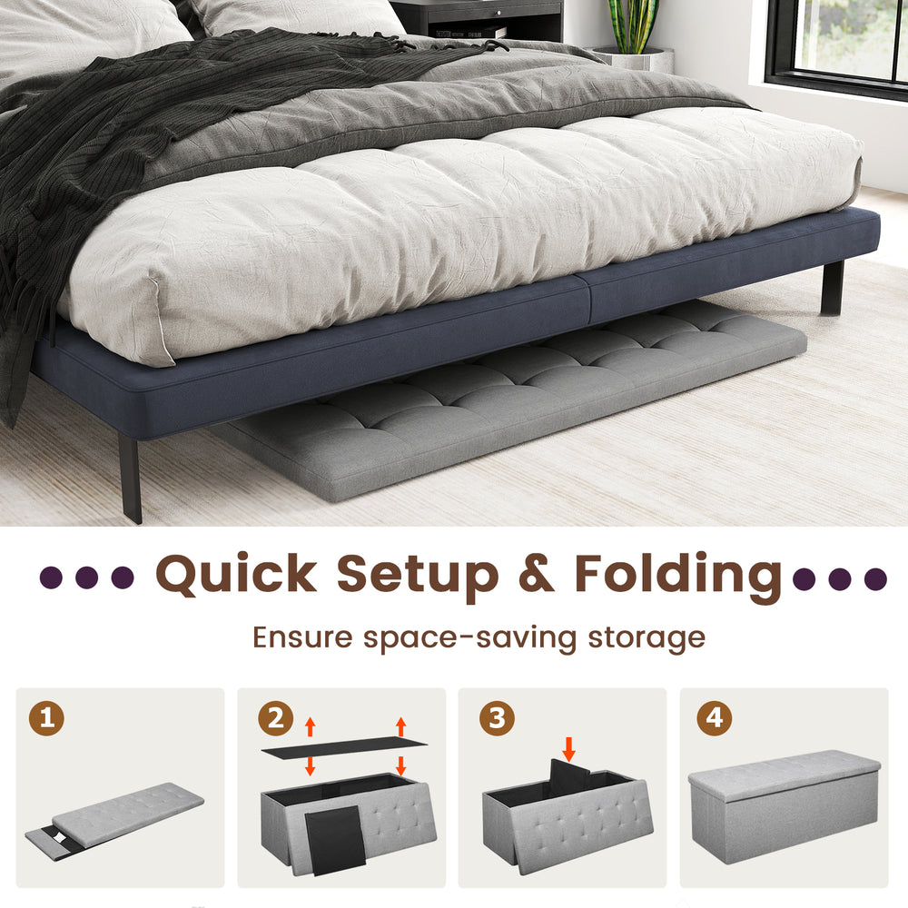Light gray folding storage ottoman bench with padded seat, featuring a removable divider for versatile organization.