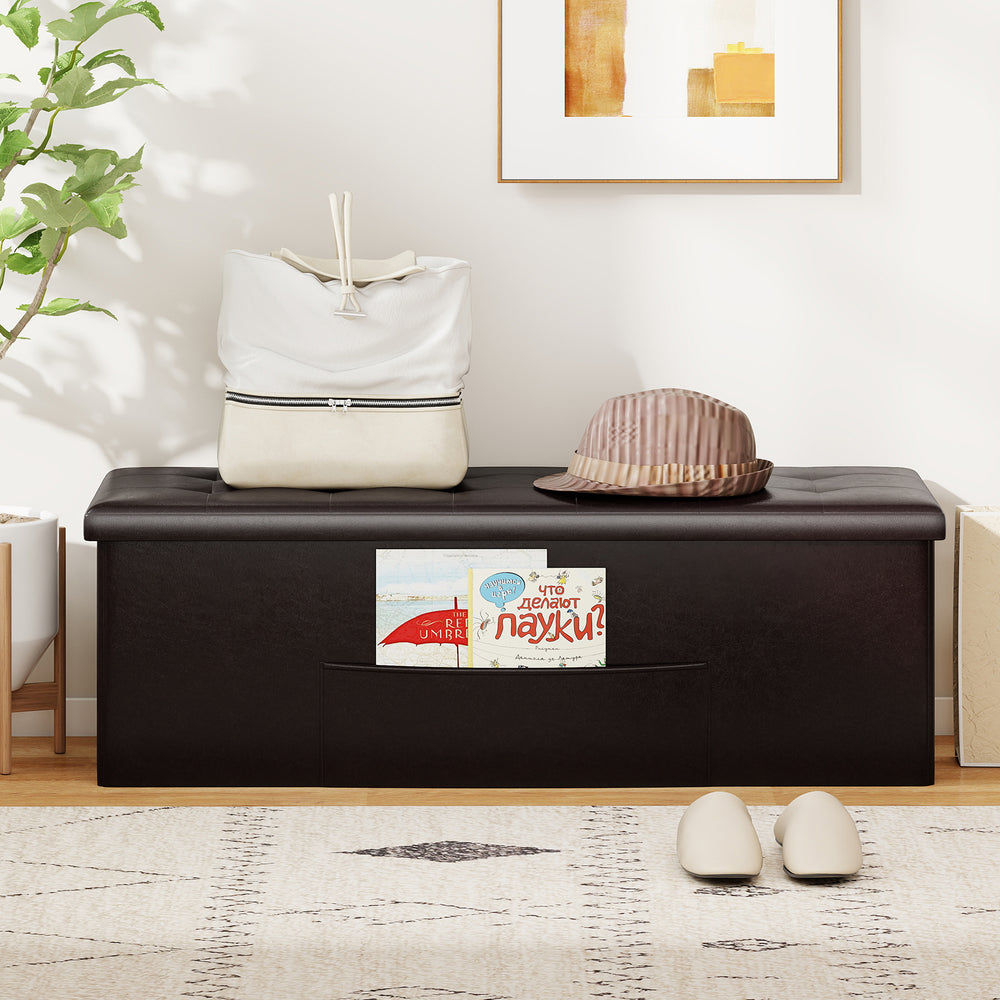 Brown folding storage ottoman bench with side pocket, 38-gal capacity, ideal for living room or bedroom organization.