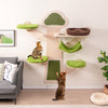 Wall-mounted cat tower with green platforms, hammock, and scratching post, perfect for playful and relaxed cats.