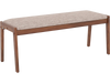 Farmhouse backless bench with rubber wood legs and beige padded seat, ideal for dining or entryway use.