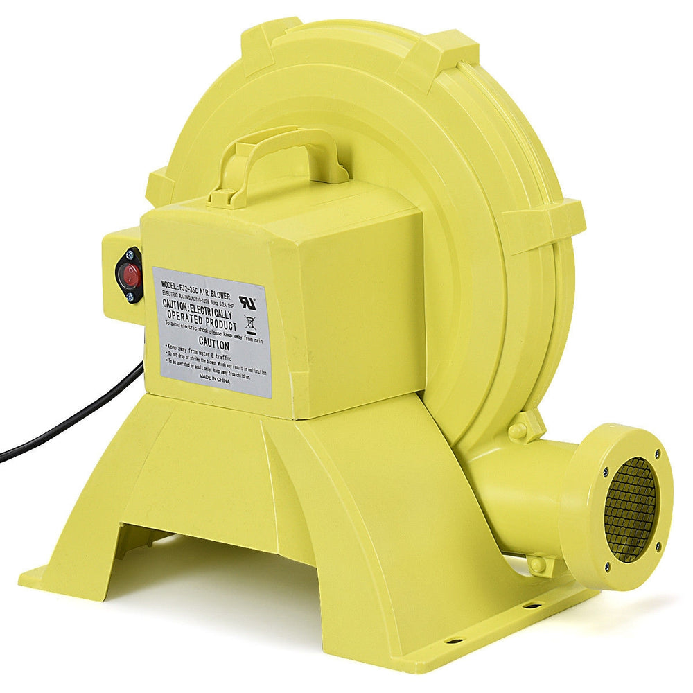 Yellow 950 W air blower pump fan with top-mounted handle, designed for inflatable bounce houses and outdoor fun.