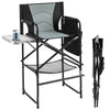 Tall gray director's chair with foldable side table, footrest, and padded armrests, perfect for camping or outdoor use.
