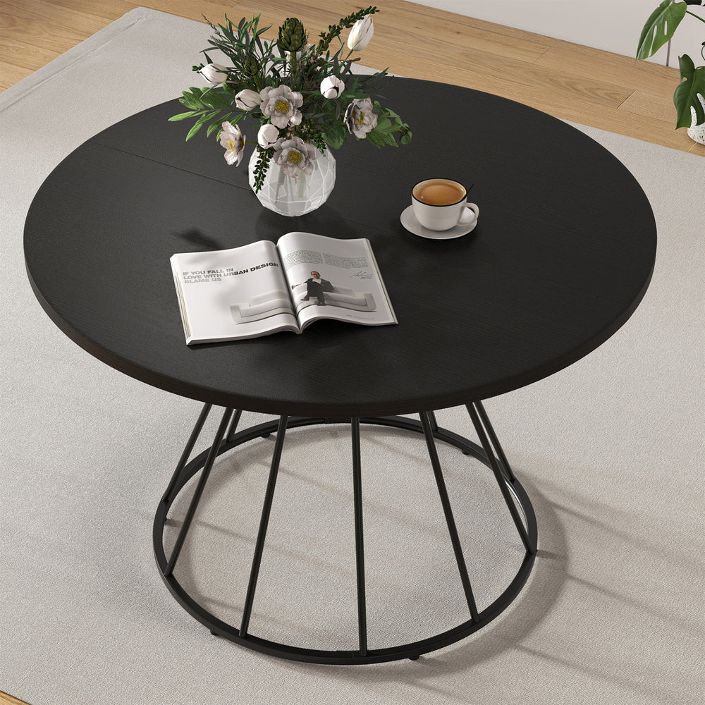 Round 47-inch black dining table with wooden tabletop, featuring a modern metal base, ideal for 4-6 persons.