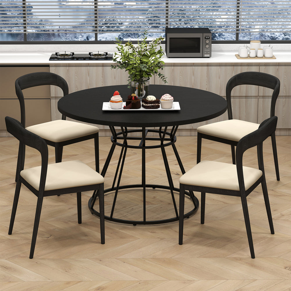 Round 47-inch black dining table with wooden tabletop and four chairs, perfect for modern kitchen gatherings.