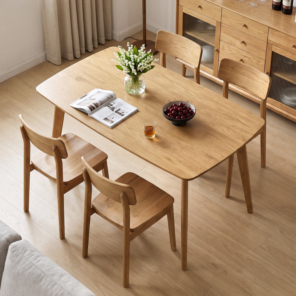 Natural solid wood dining table measuring 47 inches, featuring smooth rounded edges, ideal for family gatherings and daily use.