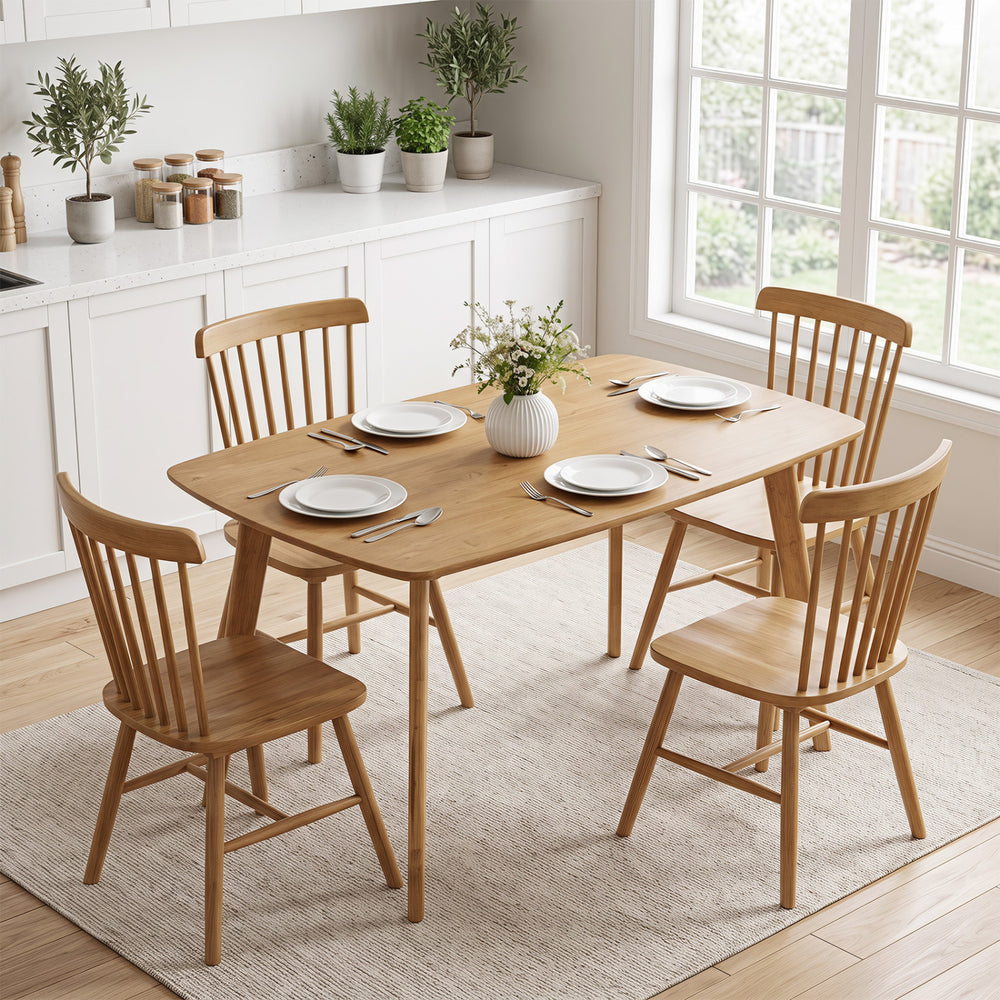 Natural 47" solid wood dining table with rounded edges, seats 4 people, perfect for family dinners in any setting.