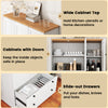 Freestanding white kitchen storage cabinet with wood-like countertop, three doors, and two large slide-out drawers.