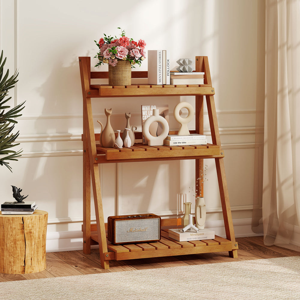 Foldable 3-tier solid wood plant stand with a smooth finish, ideal for displaying plants and decorations in any setting.