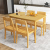 Natural 48-inch dining table with rubber wood supporting legs, offering a spacious area for family meals in the kitchen.