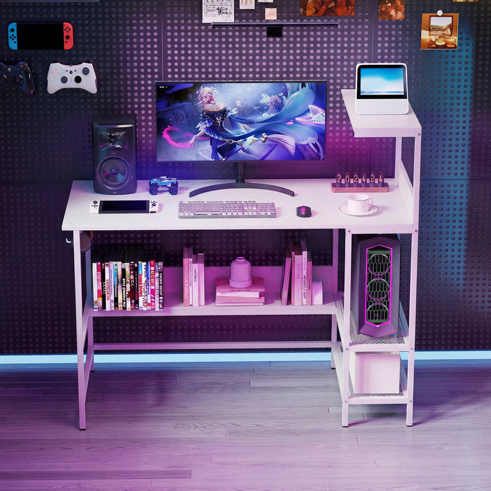 48-inch white computer desk featuring built-in power outlets, raised storage shelf, and metal mesh shelves for.