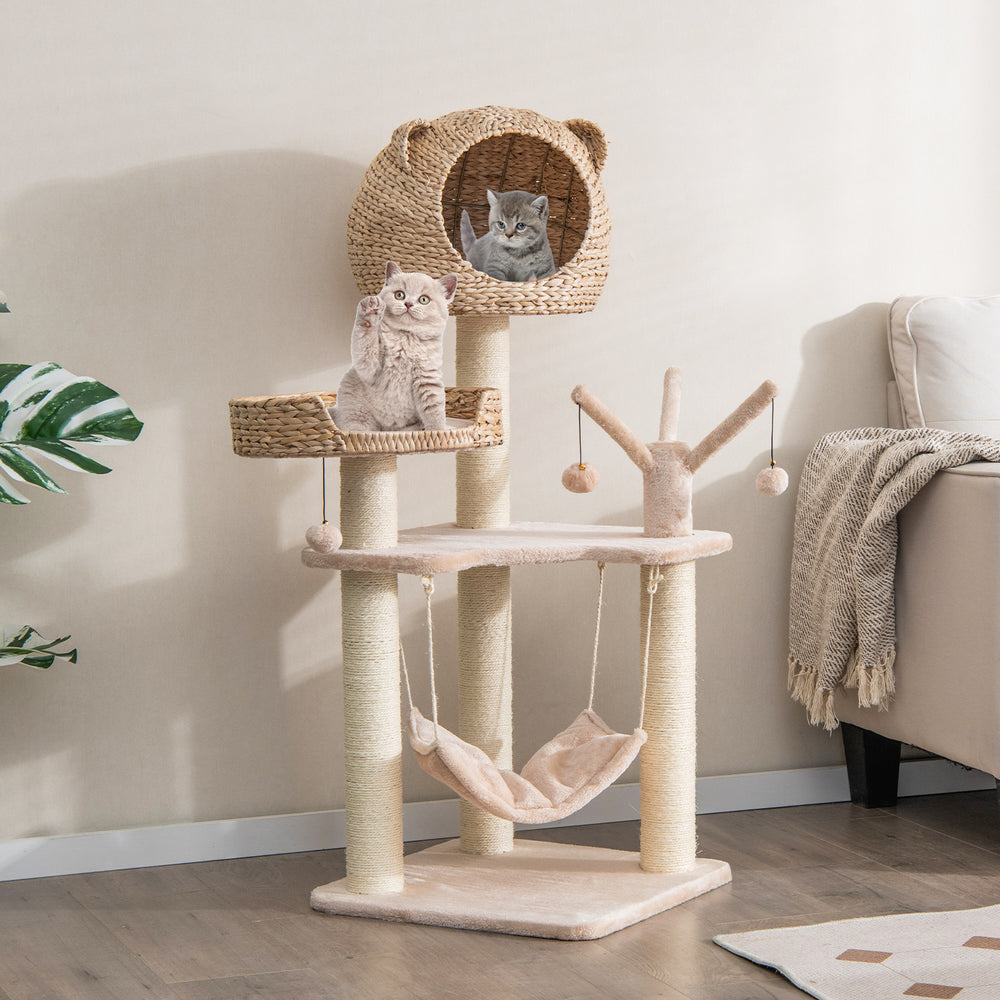 Multi-level cat tree featuring a cozy condo, hammock, and playful hanging balls, perfect for climbing and lounging.