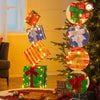 Lighted stacked gift boxes with bows, featuring 83 LED lights for festive indoor or outdoor Christmas decoration.