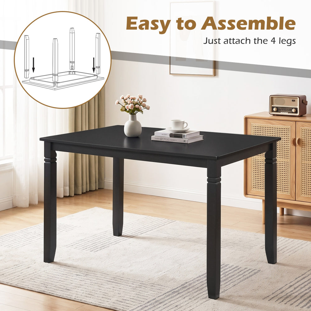 48" rectangular kitchen table in black with solid rubber wood legs, comfortably seating 4 people for dining.