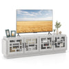 4-door TV stand in oak finish with glass cabinets, adjustable shelves, and elegant design for TVs up to 75 inches.