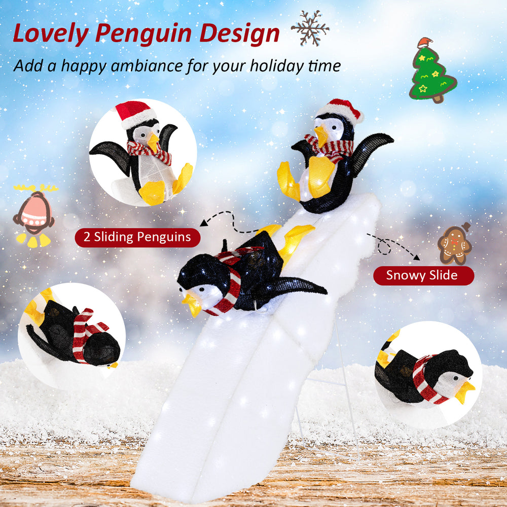 Christmas penguin ice skating decor with snowy slide, featuring 130 LED lights for festive indoor or outdoor cheer.