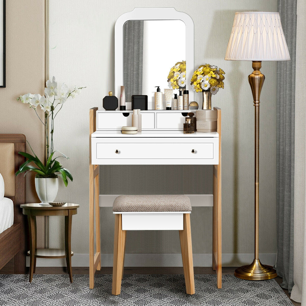 Vanity table set with cushioned stool, large mirror, and three drawers for organized cosmetics, perfect for elegant.