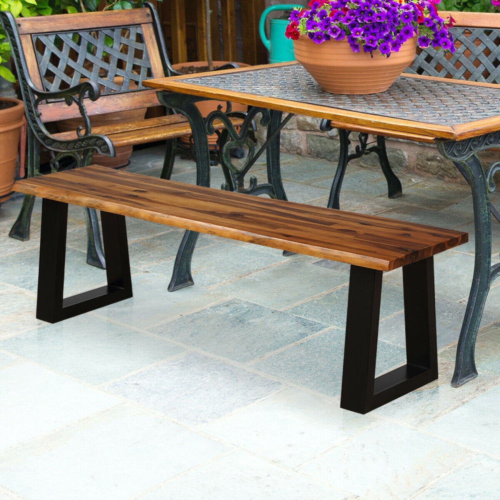 Solid acacia wood patio bench with metal legs, featuring a polished surface, perfect for outdoor dining setups.