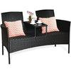 Wicker patio conversation set featuring removable cushions, a glass table, and ergonomic design for outdoor relaxation.