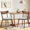 Set of 2 dining chairs with upholstered curved back, rubber wood legs, perfect for kitchen or dining room use.