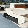 Adjustable patio rattan lounge chair with white cushioned seat, perfect for poolside relaxation and outdoor comfort.