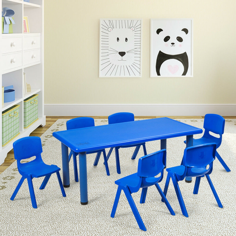 Blue plastic stackable classroom chairs arranged around a table, ideal for kids aged 3-8 for indoor and outdoor use.