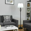Floor lamp with white fabric shade and metal base, perfect for traditional decor in living room or bedroom.