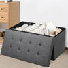 Foldable dark gray storage ottoman with padded seat and roomy interior for blankets, clothes, and toys, ideal for any.
