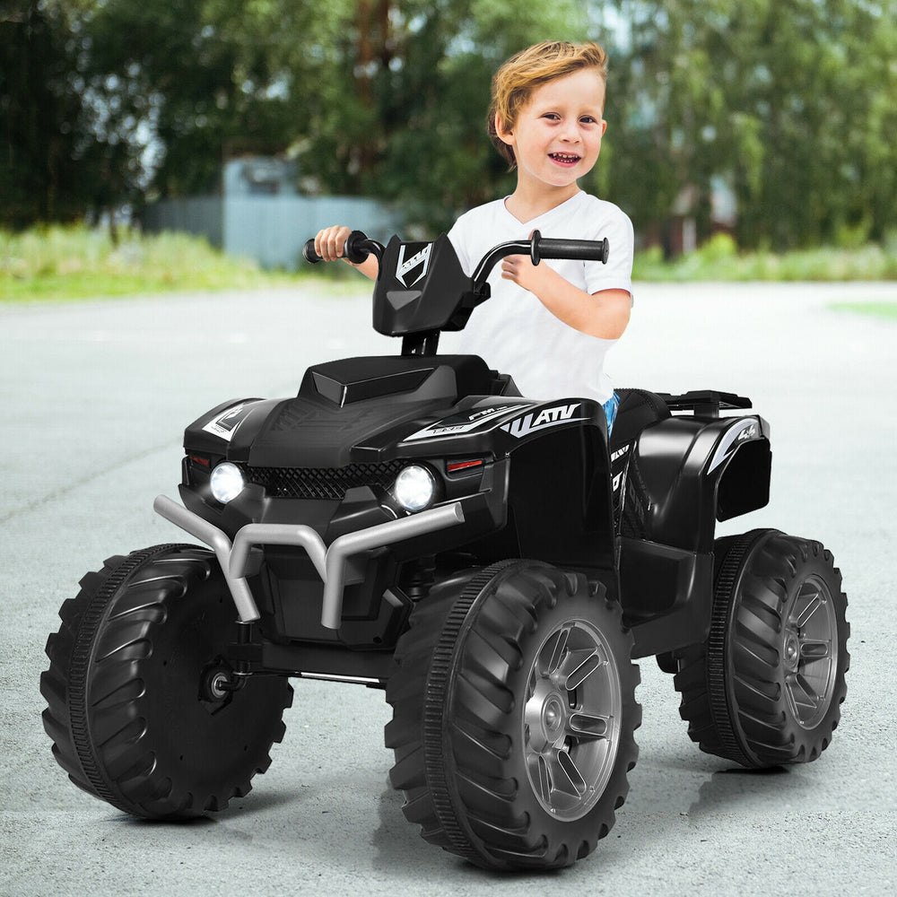 Kids ride-on ATV in black with LED lights, treaded tires, and a child smiling while driving on a paved surface.