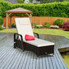 Cushioned outdoor recliner chaise lounge in black PE rattan with adjustable backrest, perfect for poolside relaxation.