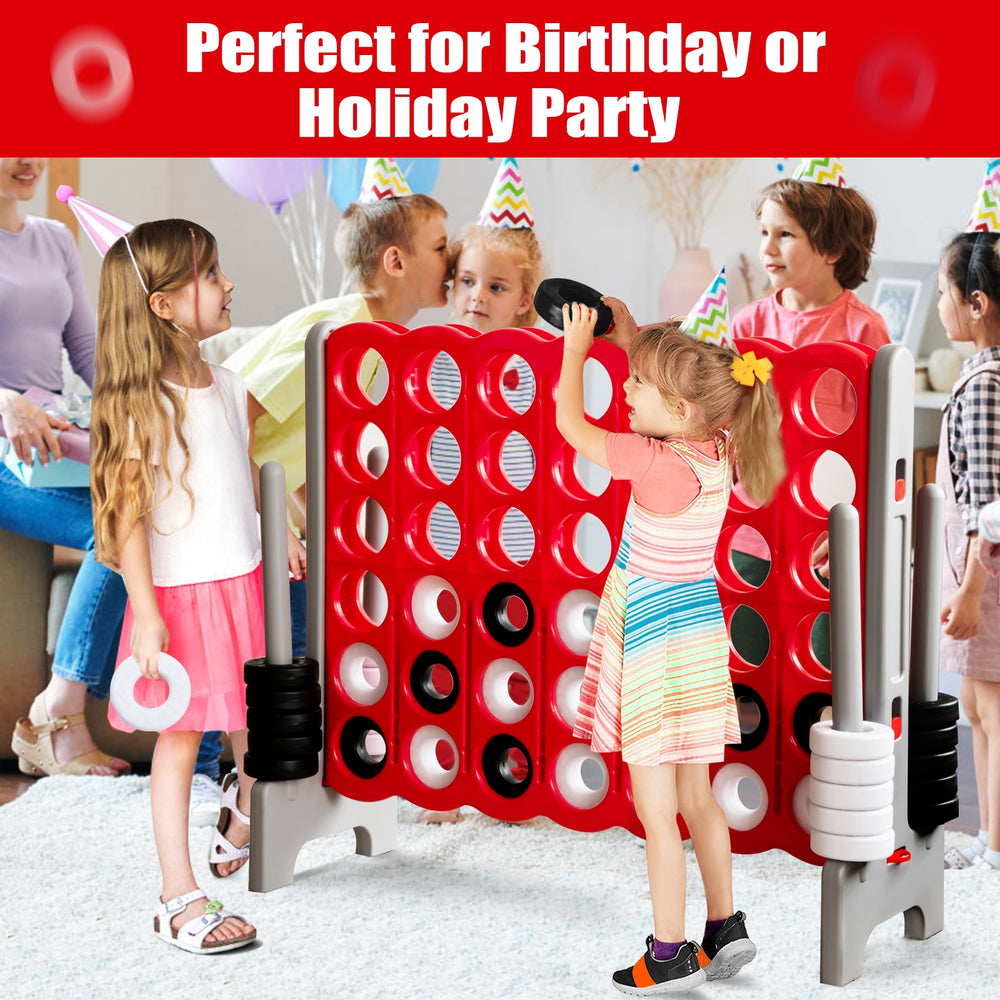 Jumbo 4 to Score game set in red with children playing, perfect for birthday or holiday parties, enhancing motor skills.