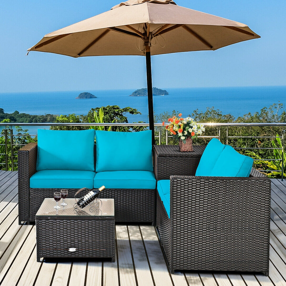 Turquoise cushioned loveseat and coffee table from a 4-piece outdoor patio rattan furniture set, ideal for garden use.