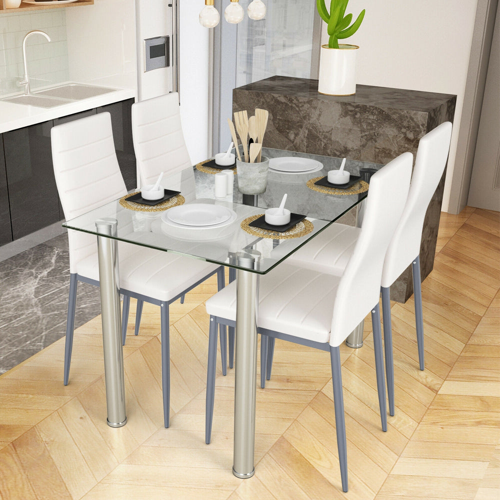 5-piece dining set featuring a clear glass table and 4 white PVC leather chairs, perfect for modern dining spaces.