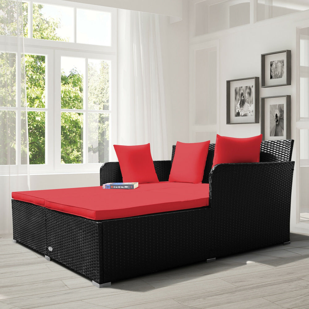 Spacious outdoor rattan daybed showcasing thick red cushions and a stylish design, ideal for outdoor lounging and.
