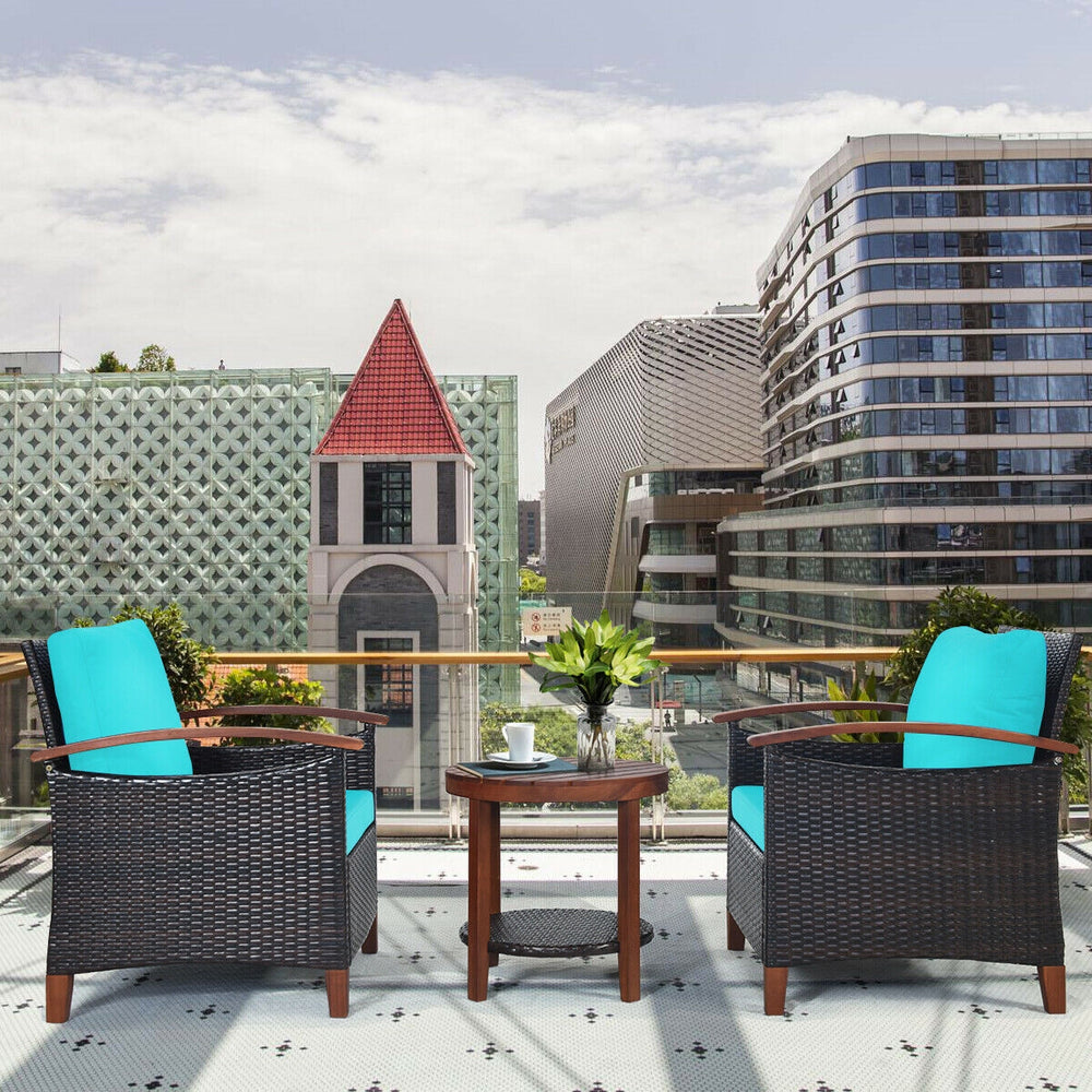 Patio rattan furniture set featuring turquoise cushions and acacia wood table, perfect for outdoor relaxation.