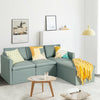 L-shaped sectional sofa in green with reversible chaise, featuring soft linen fabric and thick cushions for comfort.