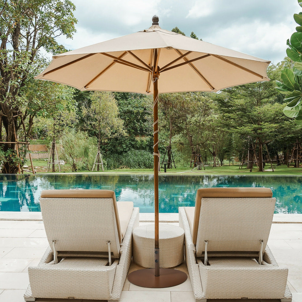 Steel umbrella base stand with 2 hand tightening knobs, designed for stability at poolside or backyard use.