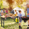 Outdoor wood folding picnic table with adjustable heights, perfect for barbecues and gatherings in natural settings.