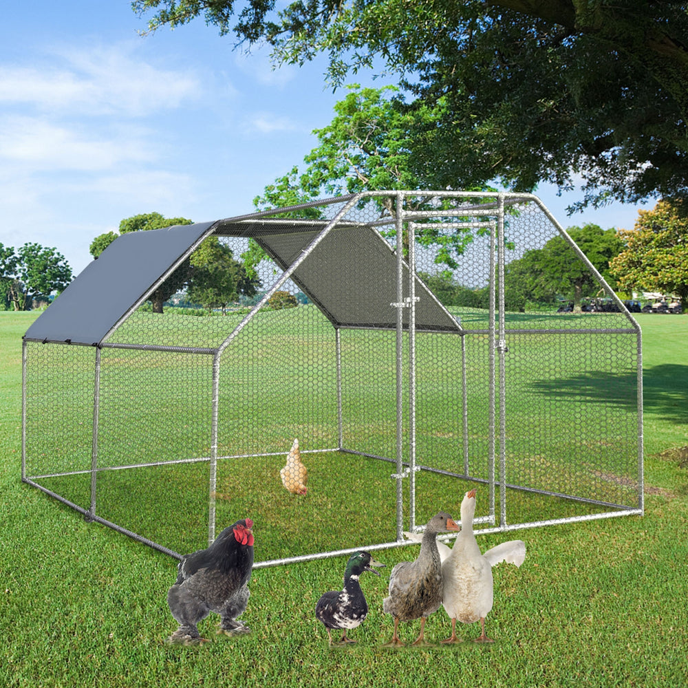 Large walk-in chicken coop run with galvanized steel frame, PVC-coated mesh, and waterproof cover for outdoor use.