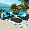 Patio rattan furniture set with turquoise cushions, featuring a coffee table and comfortable seating for outdoor.